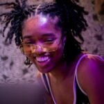 Lowray smiling while looking at her computer